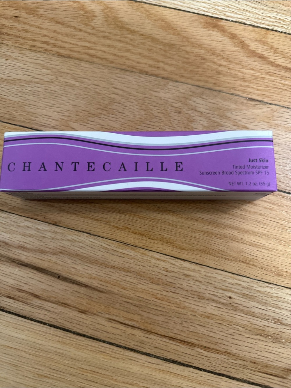 Chantecaille Just Skin Tinted Moisturizer - Purple and White Box
